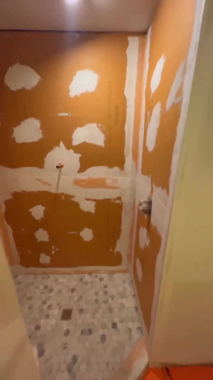The shower at the wall-preparation stage, before wall tile is installed.